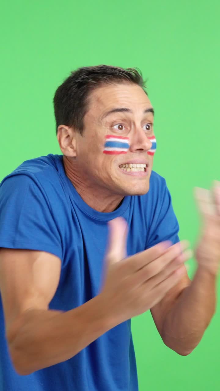 Man cheering for Thailand, angry with the decision of referee