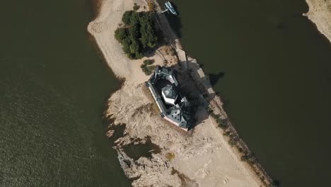 a slow dolly in shot of the pfalzgrefenstein castle from a drone above