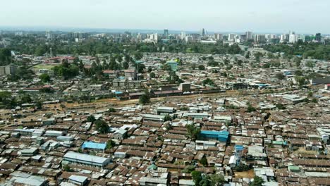 Remarkable-aerial-shot-above-vast-overpopulated-slums-and-ghettos-in-Kibera,-Nairobi,-Kenya,-Africa