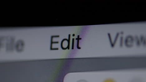 closeup on edit menu item on a computer screen with a slow push forward