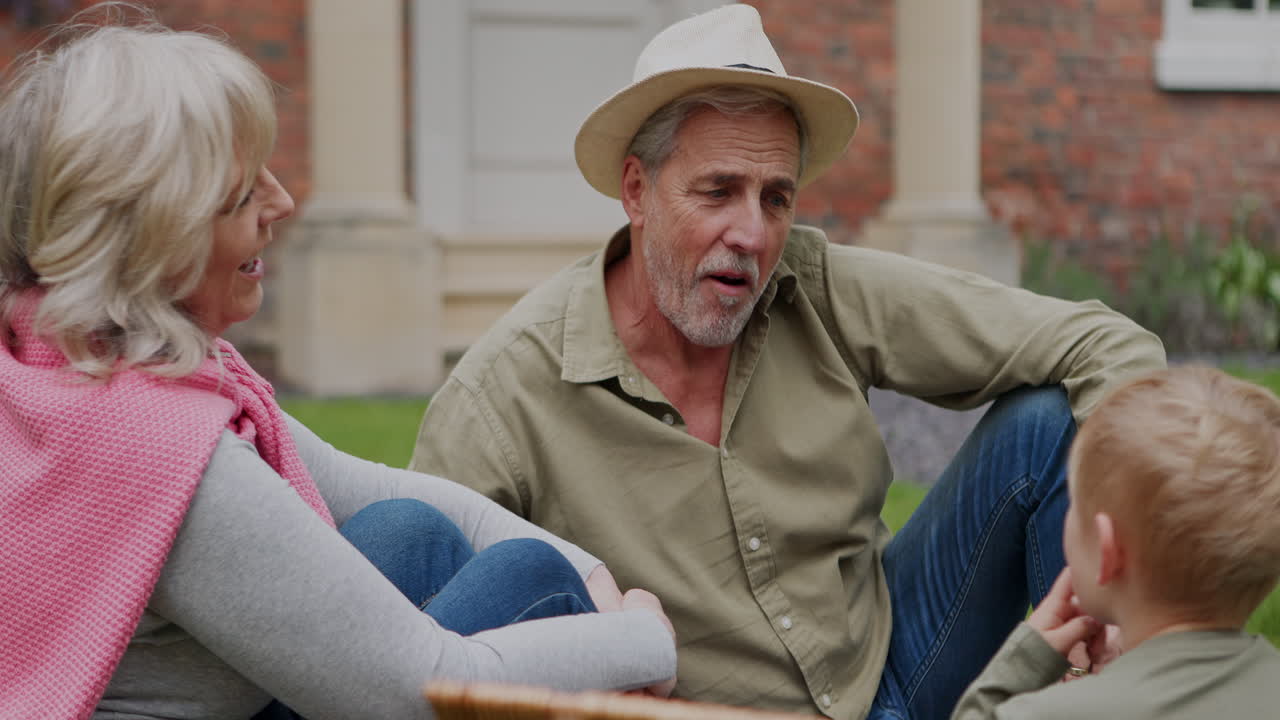 Family picnic with grandparents and child