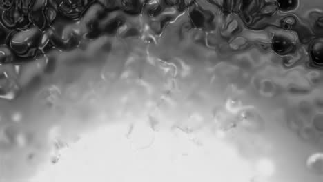 texture liquide astratte in scala di grigio