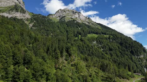 Majestic-Peaks,-Aerial-view-of-green-forest-and-Mountains