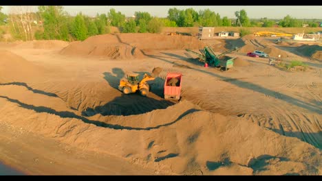 sand quarry operations with heavy machinery