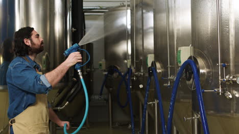 woman cleaning brewing machines