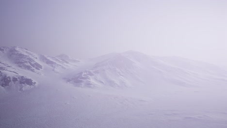 Aerial-Landscape-of-snowy-mountains-and-icy-shores-in-Antarctica