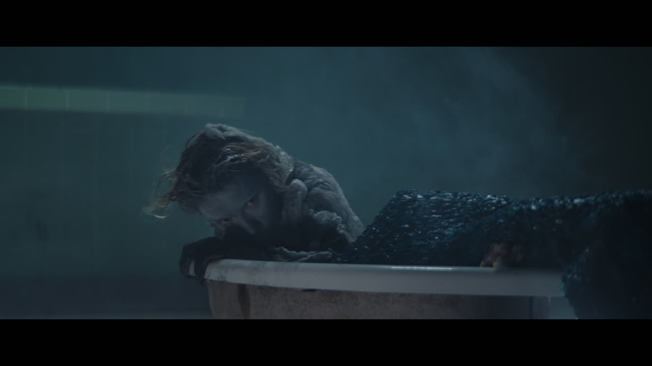 A girl meets a siren hat appears form the bathtub with hot water