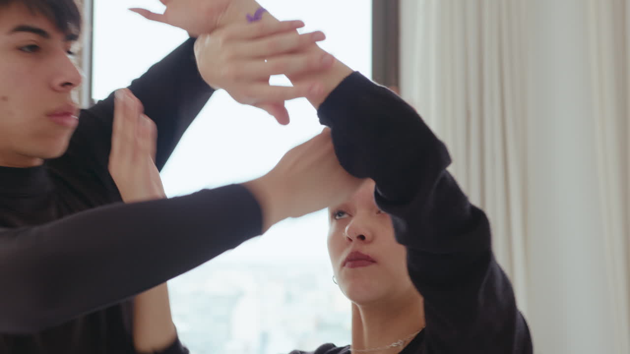Duet Dancing Contemporary with Arms Entwined in Studio