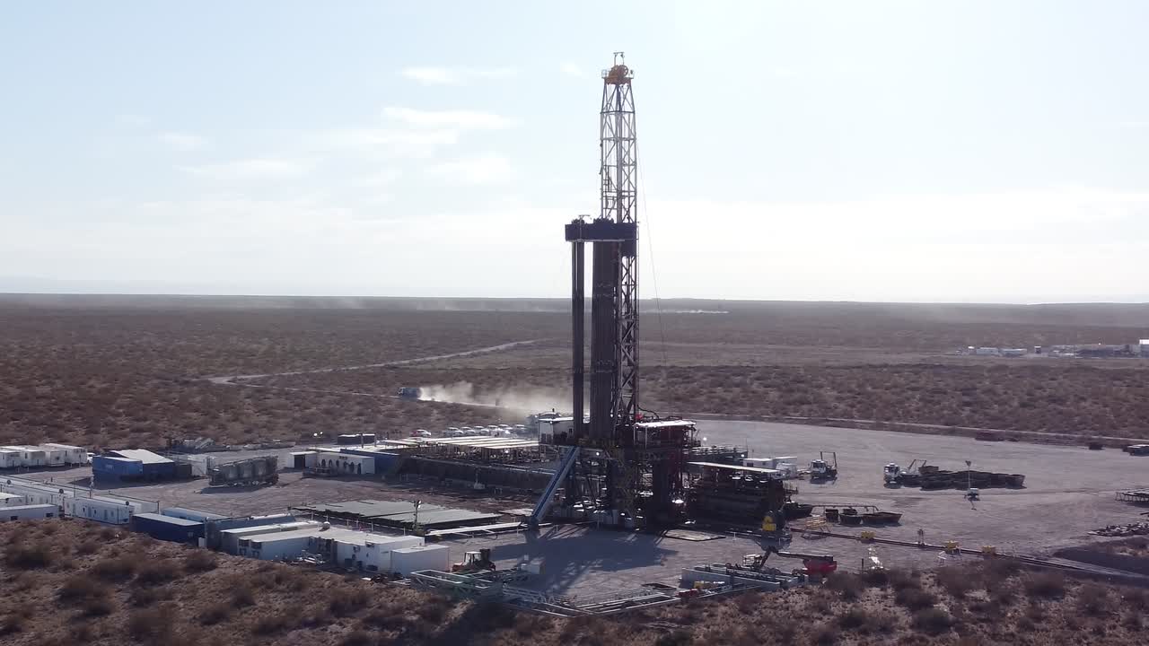 Aerial view of oil rig in Vaca Muerta, Argentina, vast landscape