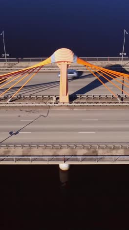 vertical shot of south bridge in kengarags, riga. overhead drone shot of pillar with vehicles