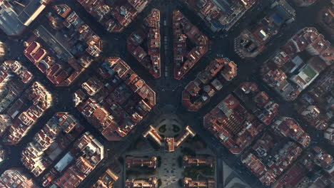 Buildings-arranged-into-regular-blocks.-Top-down-footage-of-urban-borough-at-golden-hour.-Barcelona,-Spain