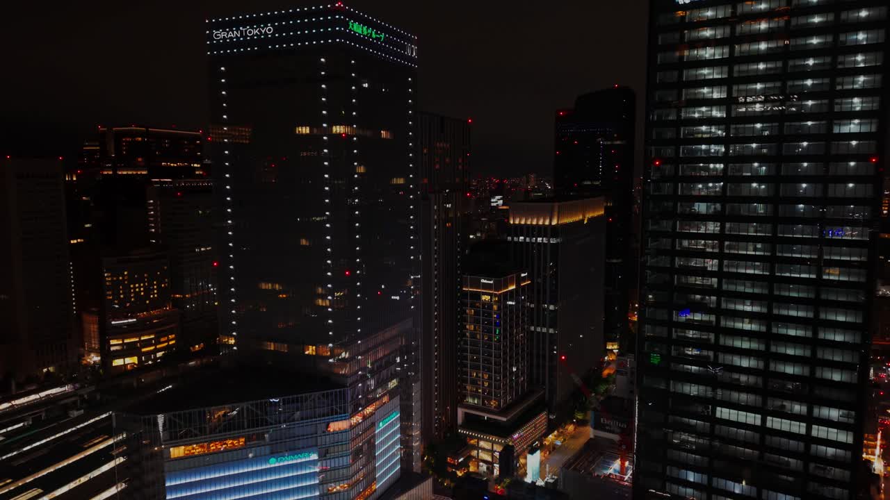 Nighttime Cityscape with Illuminated Skyscrapers