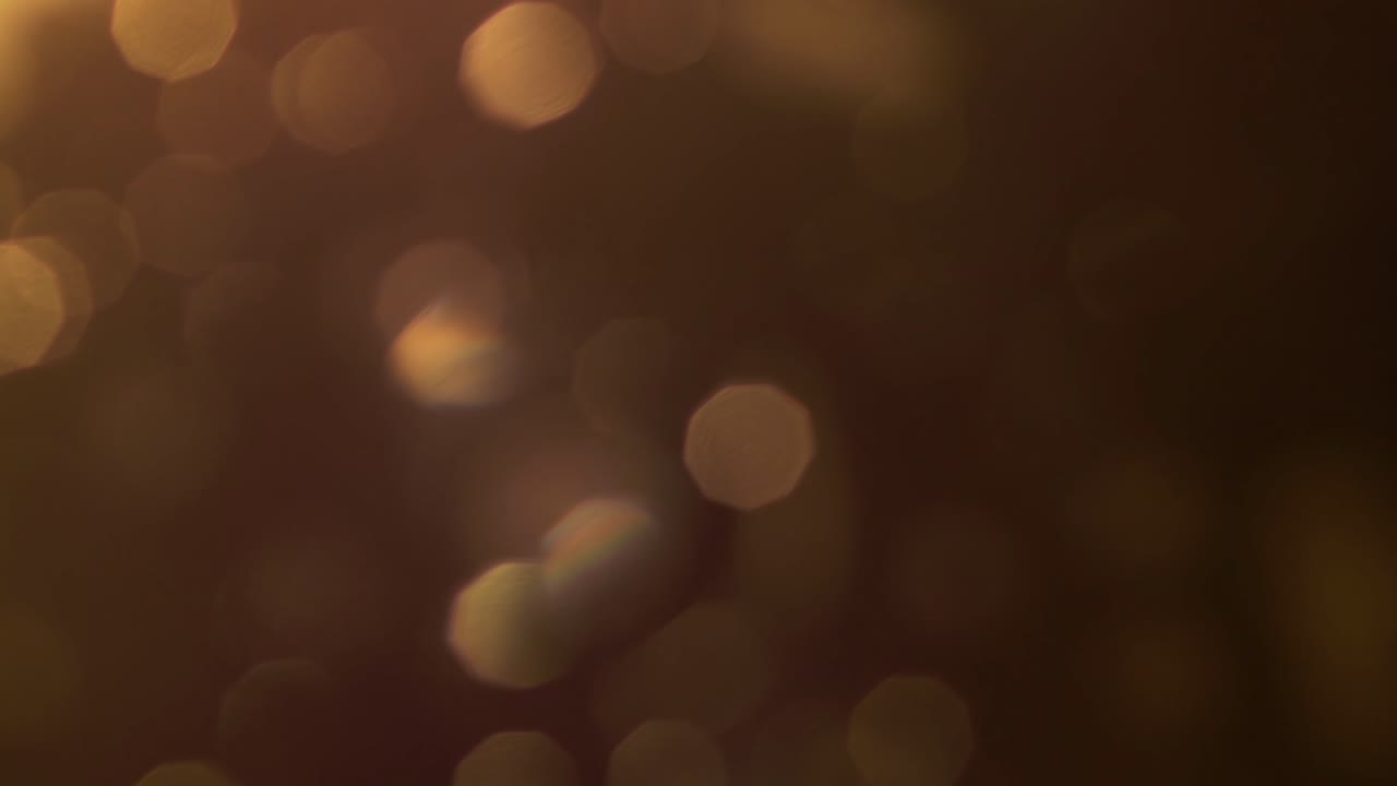 Luce Bokeh Calda che Sfuma nell'Oscurità