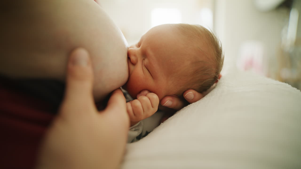 Newborn Baby Boy Breastfeeding Closeup