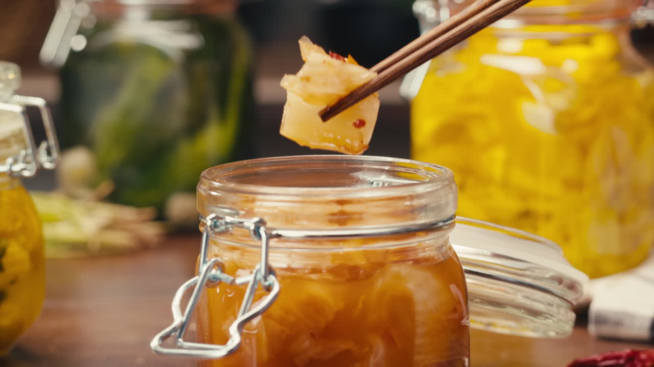 Close-up of fermented spicy cabbage kimchi with in can. Preservation of vegetables in glass jars. Fermentation preserved kimchi cabbage with spices. Asian cuisine.