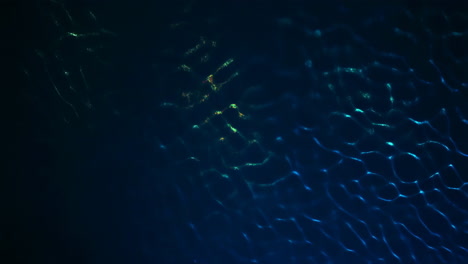 abstract dynamic blue and green light ripples