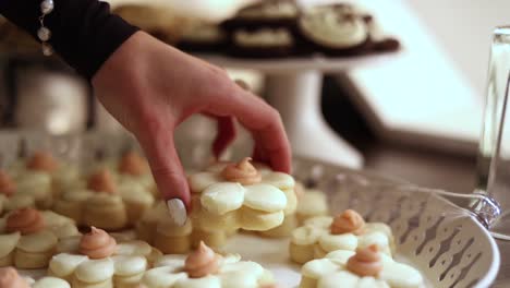 Hand-Picking-up-and-Indulging-in-Delicious-Sweet-Frosted-Sugar-Cookie