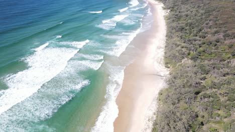 aerial drone rising above stunning beach and scenic landscape in noosa, queensland