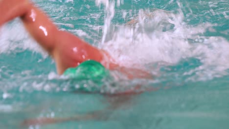 Fit-swimmer-doing-the-front-stroke-in-the-swimming-pool