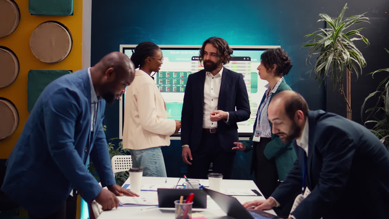 Employees addressing their team leader about practices and lessons learned