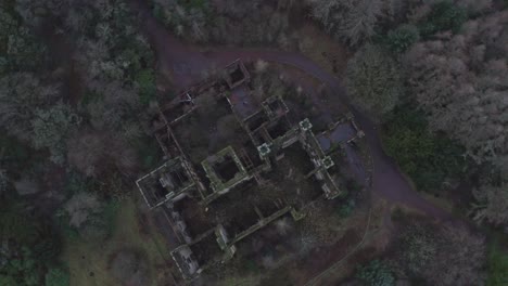 rotating top down aerial shot of an abandoned hospital