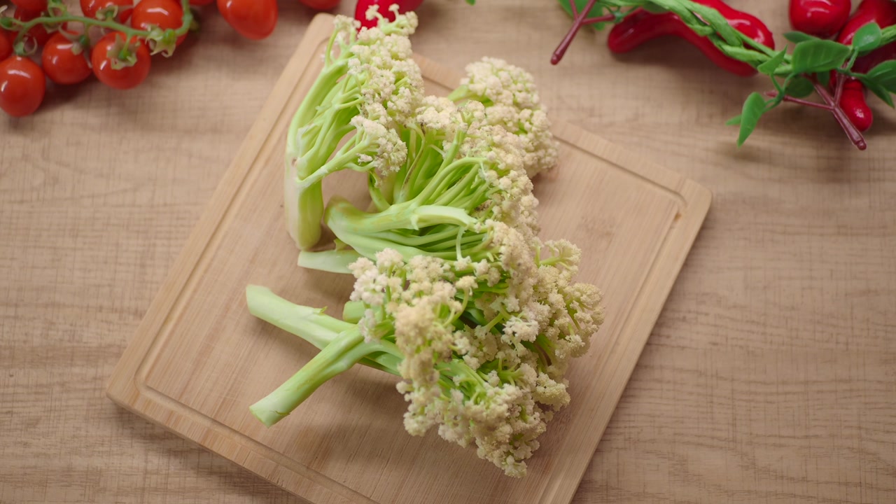 Fresh Romanesco Broccoli on a Wooden Cutting Board