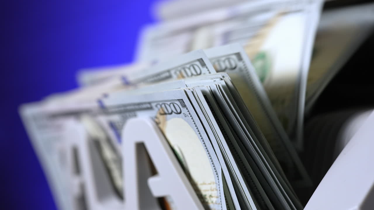 Financial process in bank. Counter machine for banking and commercial activity. Automatic calculates a large amount of dollar banknotes. Close-up.