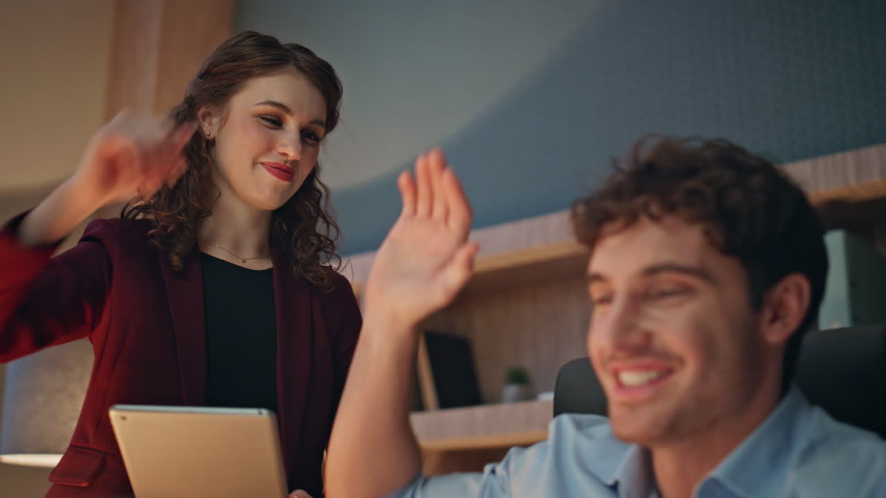 Happy colleagues rejoicing success reading great news at laptop close up.