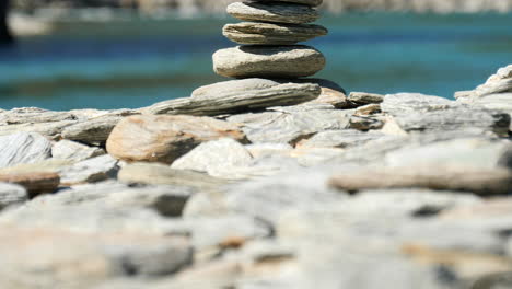 stones stacked into a cairn - macro pedestal up reveal