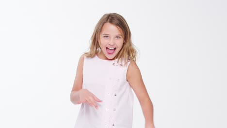 girl jumping and posing against white studio background