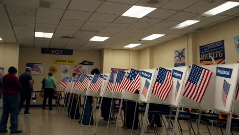 american flags and voting booths at a polling place