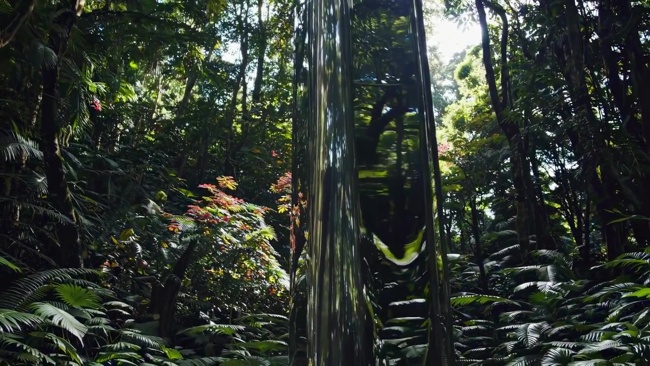 Reflective Metal Pillar Standing in Lush Tropical Rainforest
