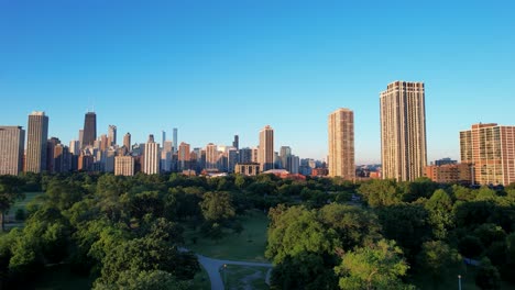 Sunrise-Over-Sustainability-City-Park-With-Chicago-Downtown-Skyline-Drone-View