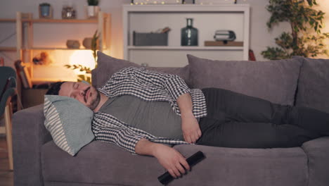 man sleeping on a couch