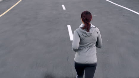 Woman,-fitness-or-city-running-on-road