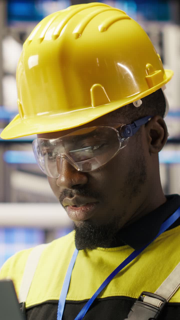 Vertical video Professional working in smart factory, testing automated systems