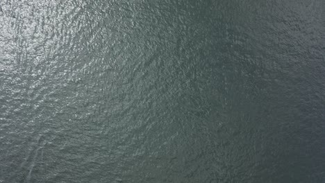 calm water surface background, loopable, aerial view