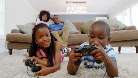 children playing video game in living room