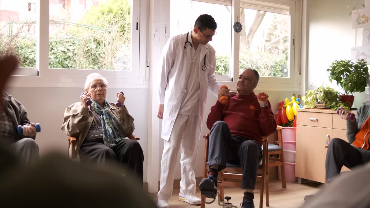 Male doctor controlling aged people exercising with bike pedals