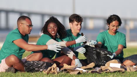 smiling volunteers sorting rubbish