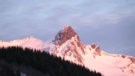 sunset light on snowy mountain in northern norway