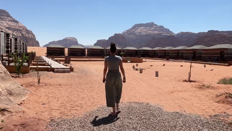 women in bedouin camp walking in wadi rum, jordan 4k