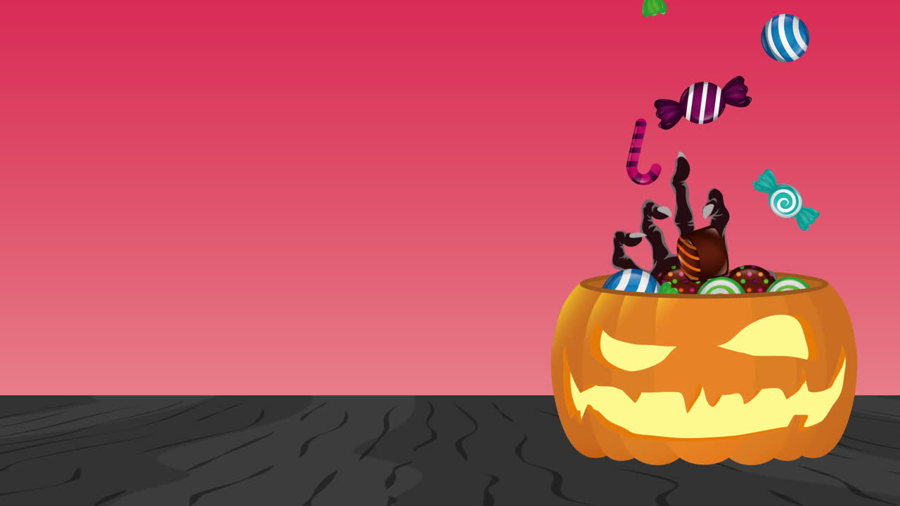 zucca di halloween con mano di zombie e caramelle dolci