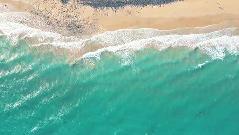 Spectacular-aerial-top-view-background-photo-of-ocean-sea-water-white-wave-splashing-in-the-deep-sea