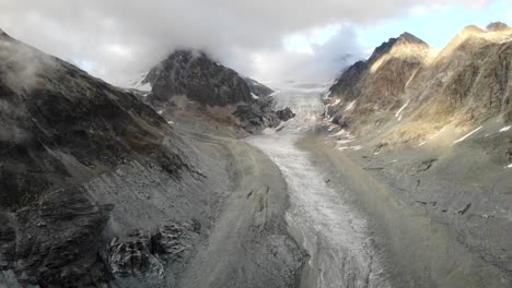 Brenay-Glacier-in-Valais,-Switzerland-at-sunset,-side-to-side-aerial-flyover