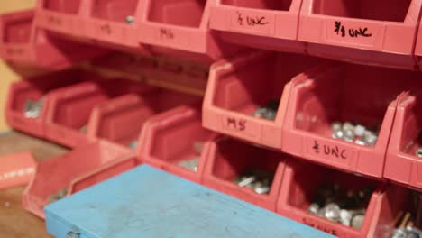 Slider and panning shot of a tool shelf inside an engineering workshop