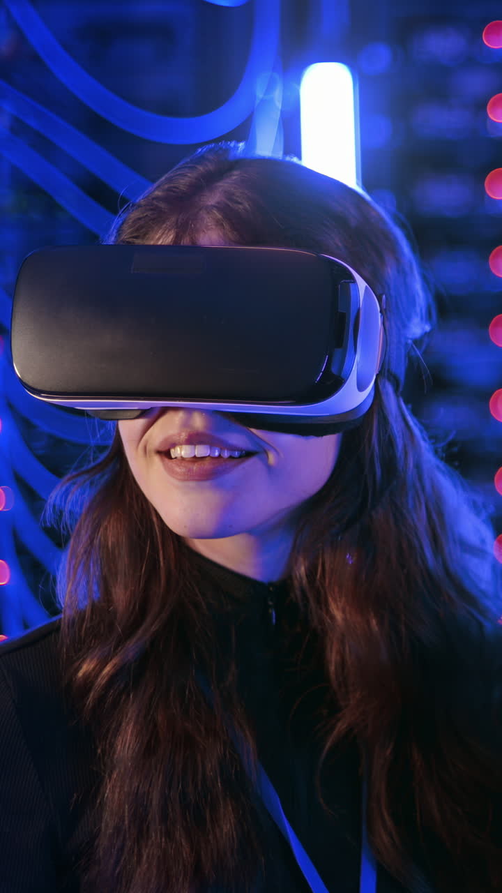 Woman using a Virtual Reality headset in a server room. Vertical
