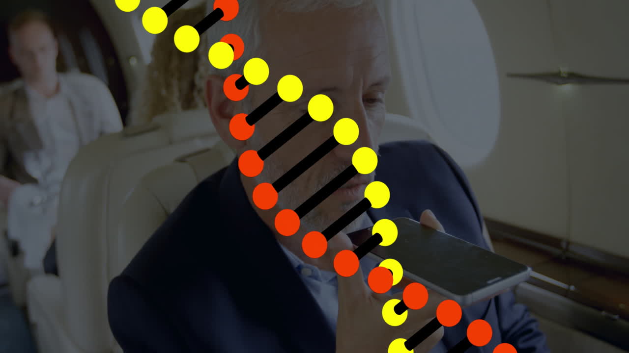 Businessman using smartphone with DNA strand animation overlay in private jet