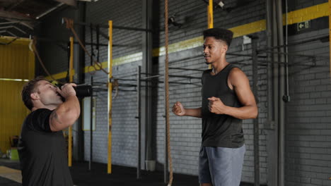 workout buddies celebrating success in the gym