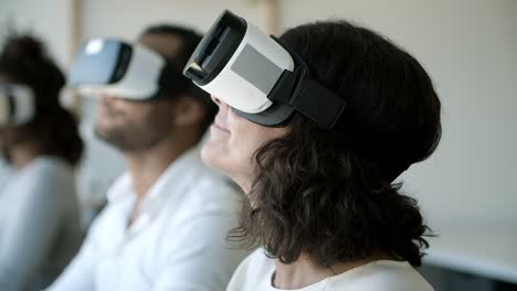 Closeup-shot-of-excited-mature-tester-experiencing-VR-headset.